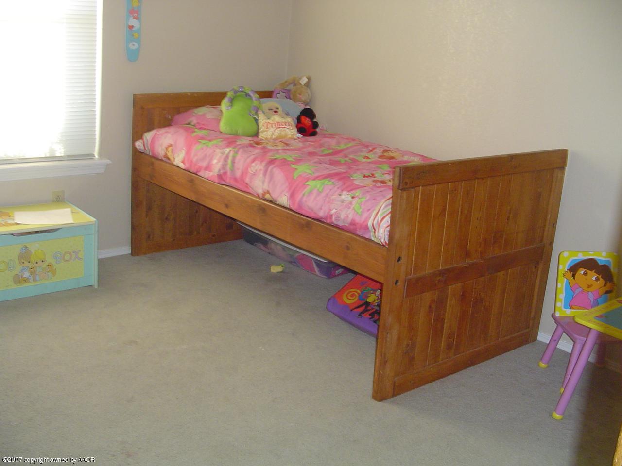 4202 Rondo Avenue Amarillo, TX 79110 - Photo 12 of 14 a bedroom with a bed and a couch