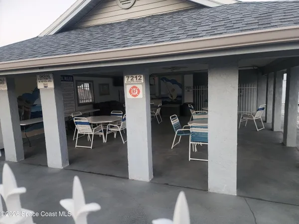a kitchen with a refrigerator and a stove