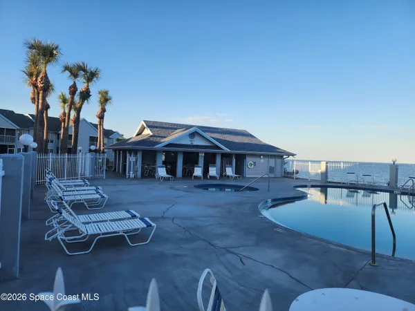 a view of roof deck with furniture