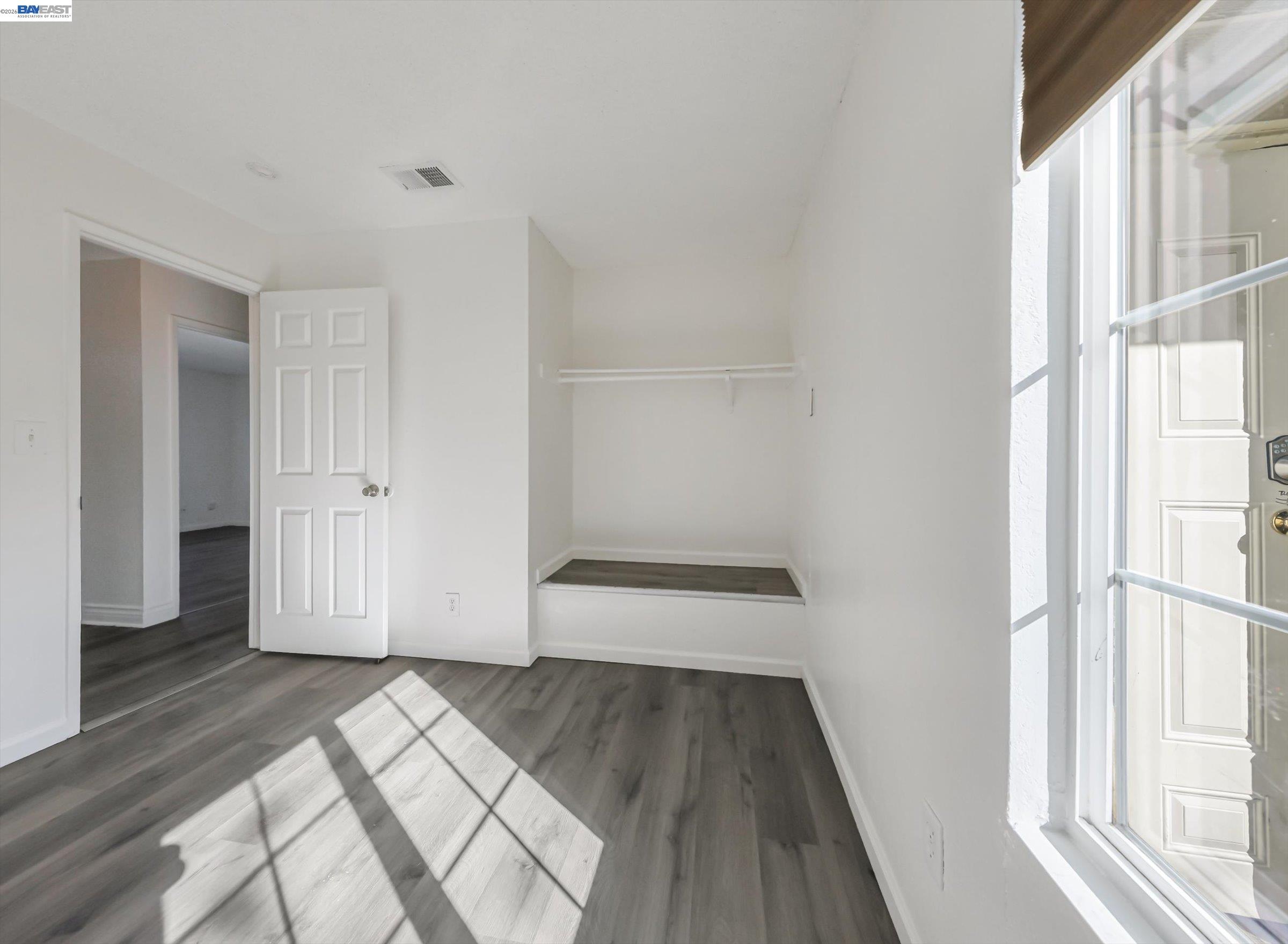 3432 Danielle Place Bay Point, CA 94565 - Photo 18 of 36 an empty room with wooden floor and windows