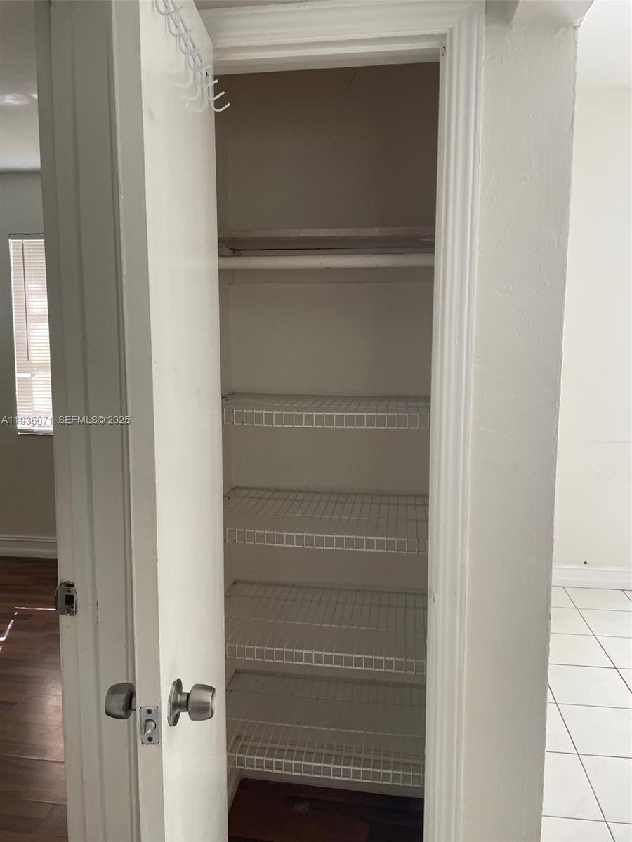 115 Virginia Road, Unit 115 Hollywood, FL 33023 - Photo 11 of 12 a view of walk in closet