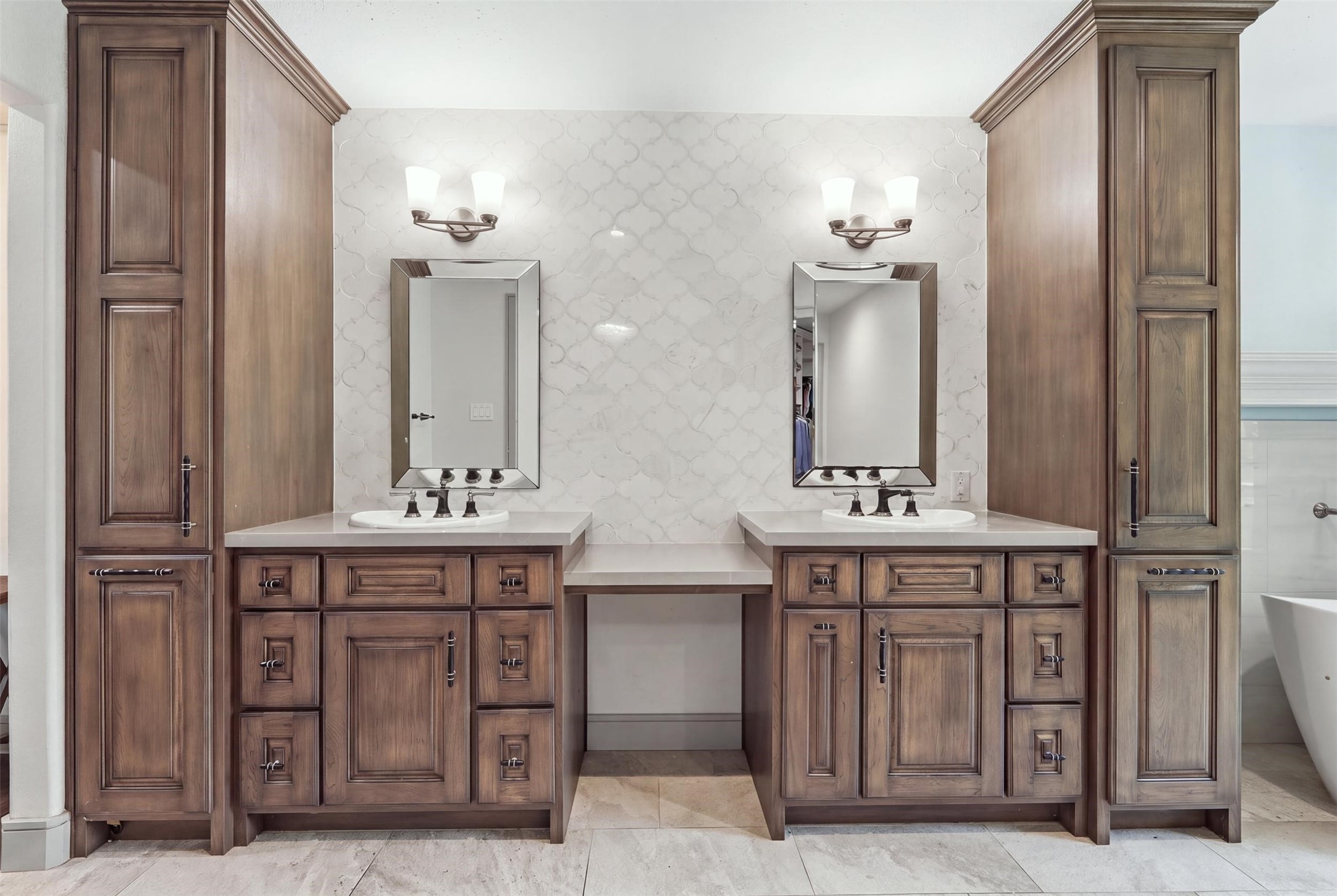 6518 Elmgrove Road Spring, TX 77389 - Photo 23 of 39 Beautifully appointed primary bath with dual vanities, custom cabinetry, abundant storage, and a dedicated vanity area.