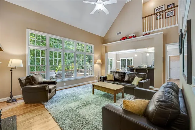 a view of a workspace with furniture and wooden floor