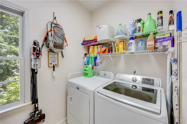 a bedroom with a large bed and a television