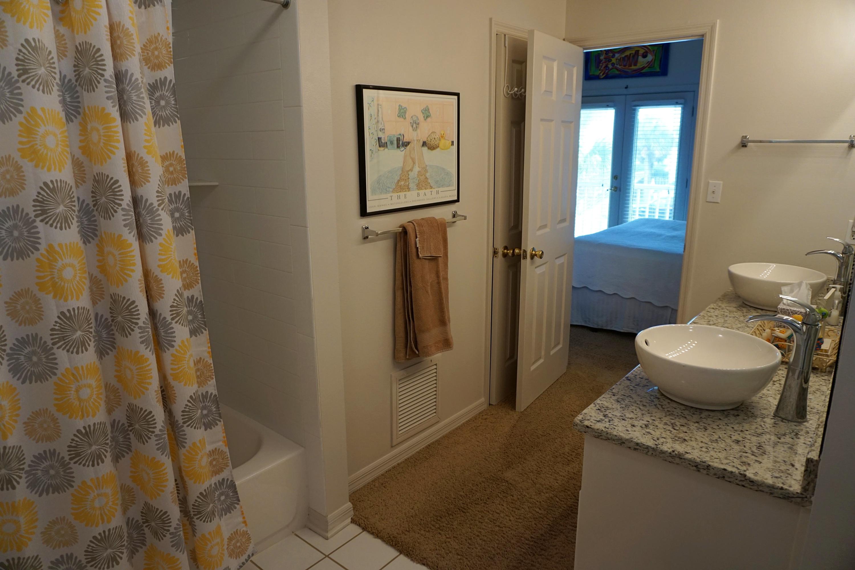 4944 West Co Highway Santa Rosa Beach, FL 32459 - Photo 16 of 24 a bathroom with a granite countertop sink and a mirror