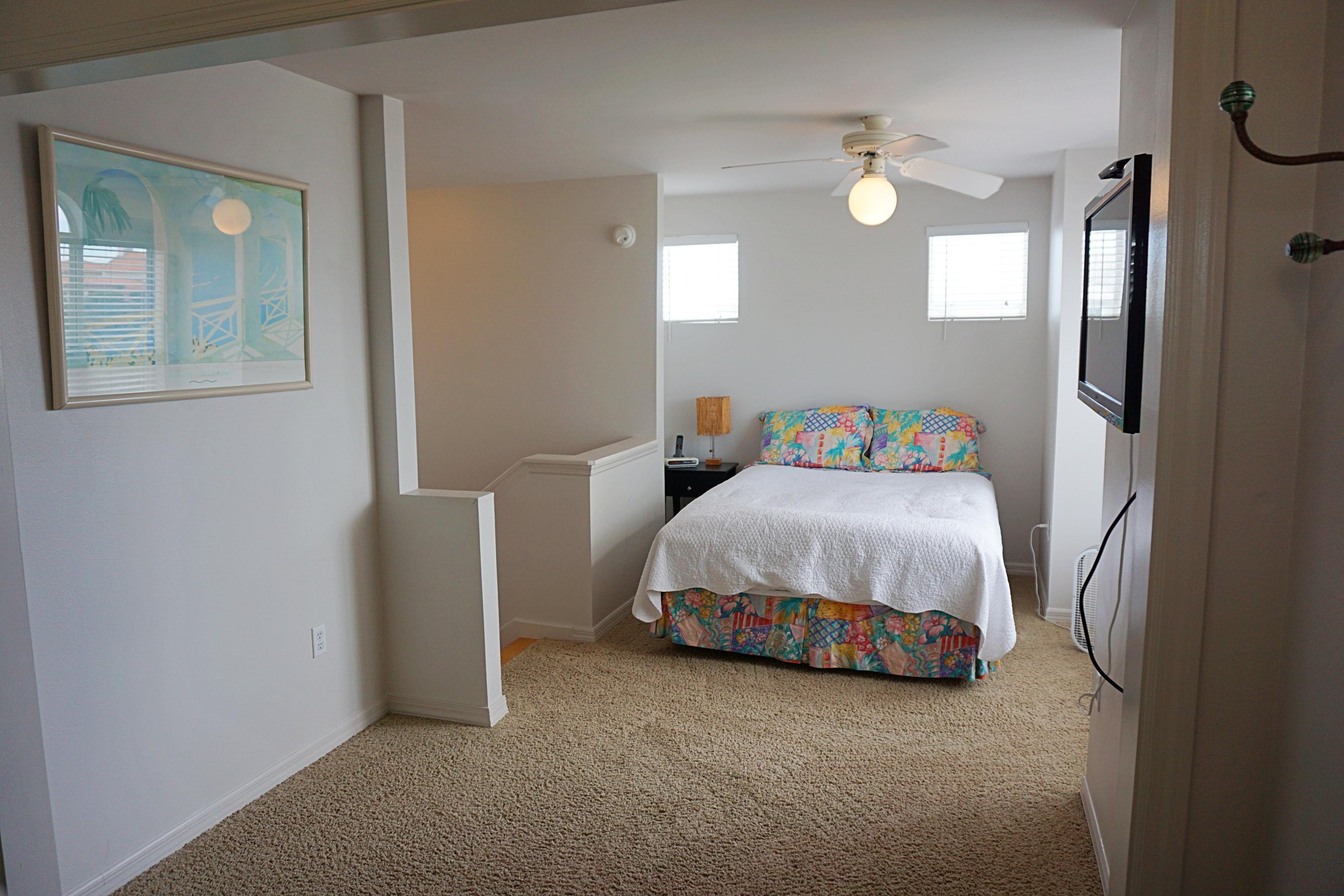 4944 West Co Highway Santa Rosa Beach, FL 32459 - Photo 19 of 24 a bedroom with a bed and a chandelier