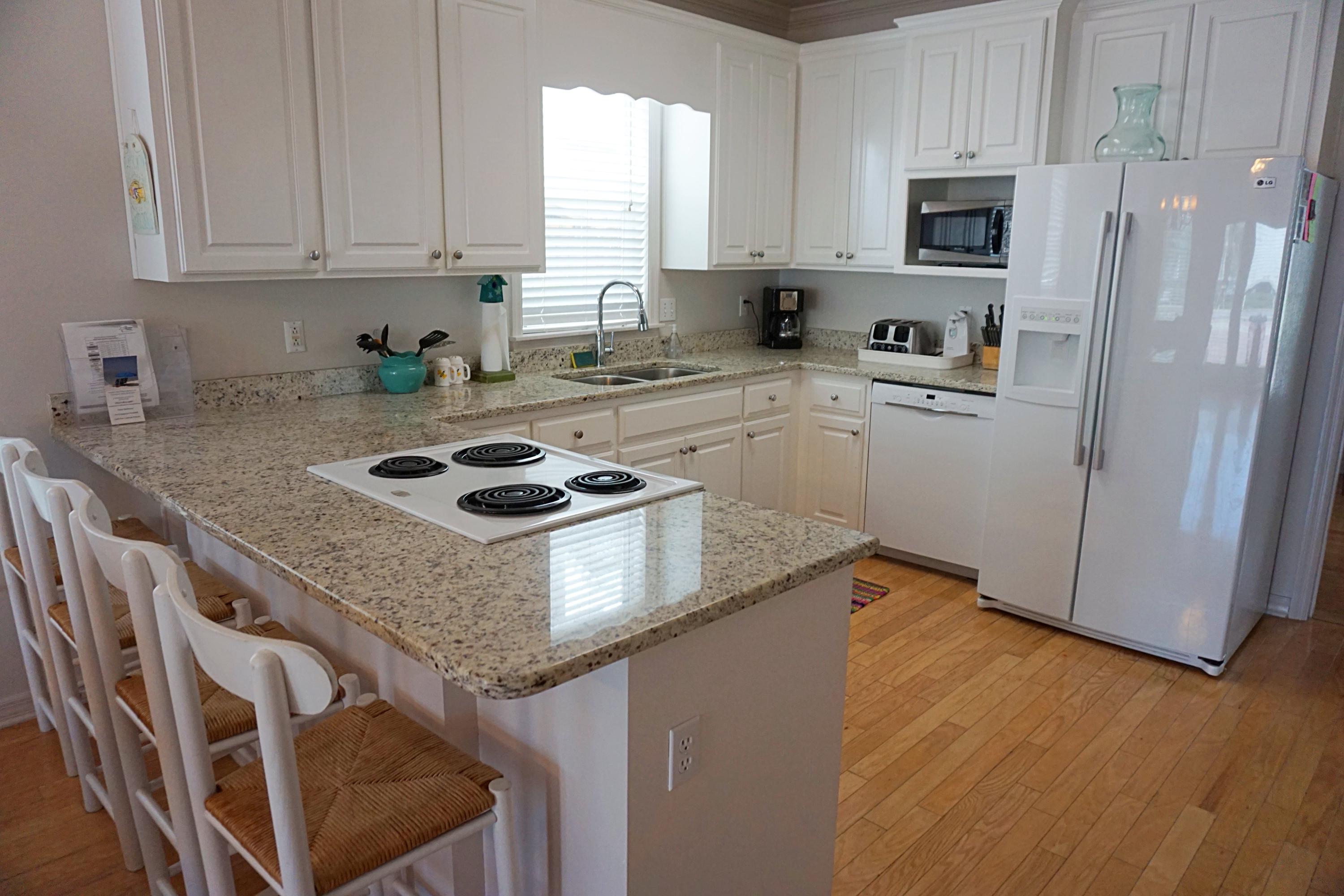 4944 West Co Highway Santa Rosa Beach, FL 32459 - Photo 6 of 24 a kitchen with granite countertop a sink cabinets and stainless steel appliances