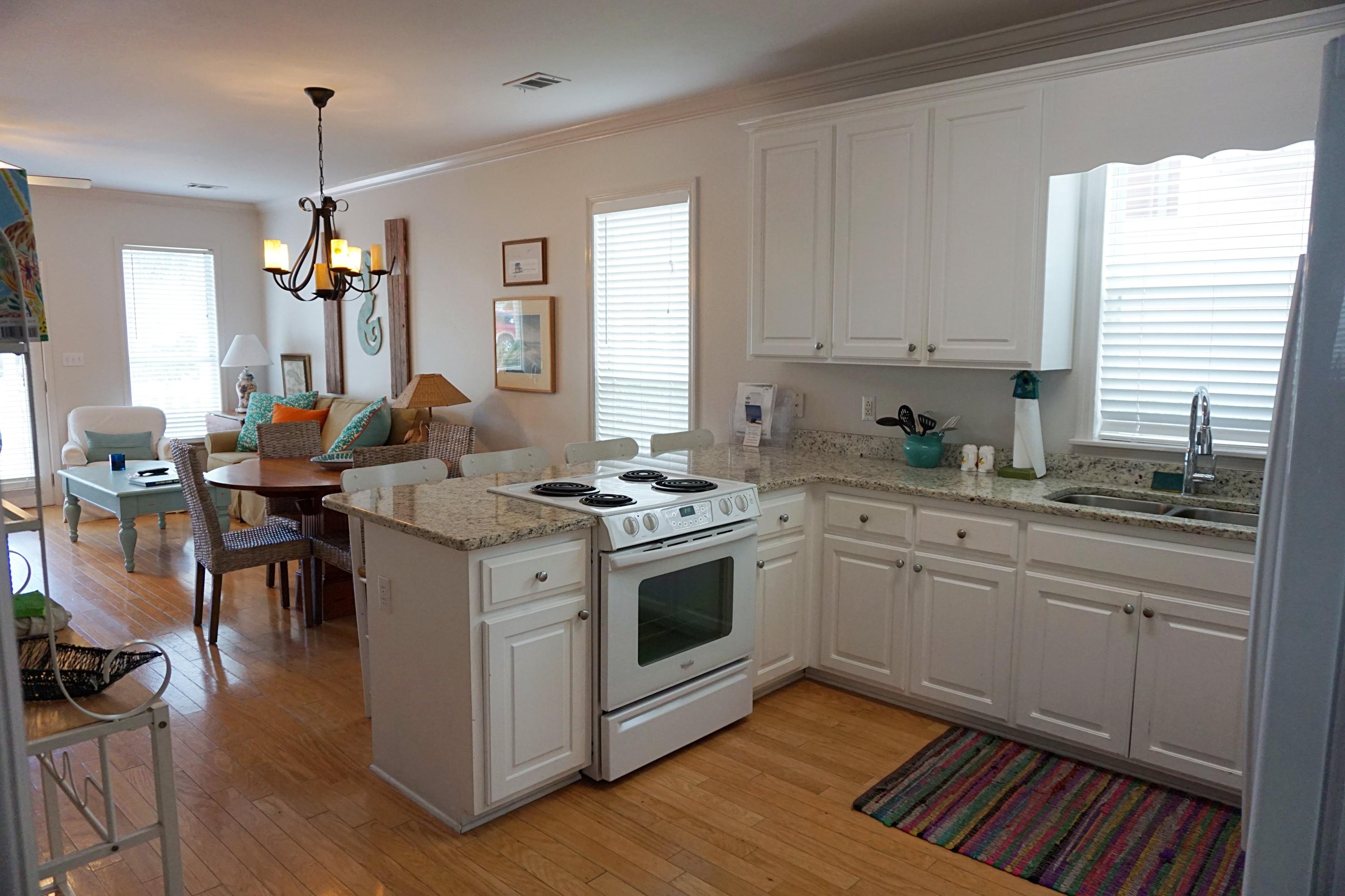4944 West Co Highway Santa Rosa Beach, FL 32459 - Photo 7 of 24 a kitchen with a sink cabinets and window