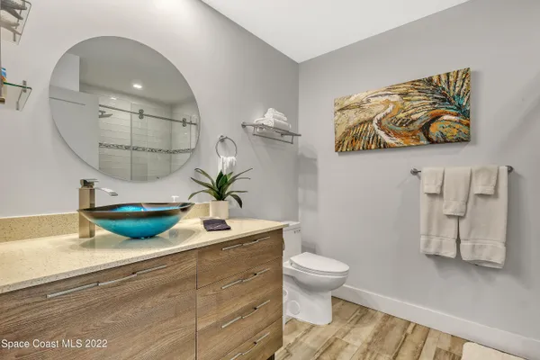 a view of bathroom with a toilet and a sink