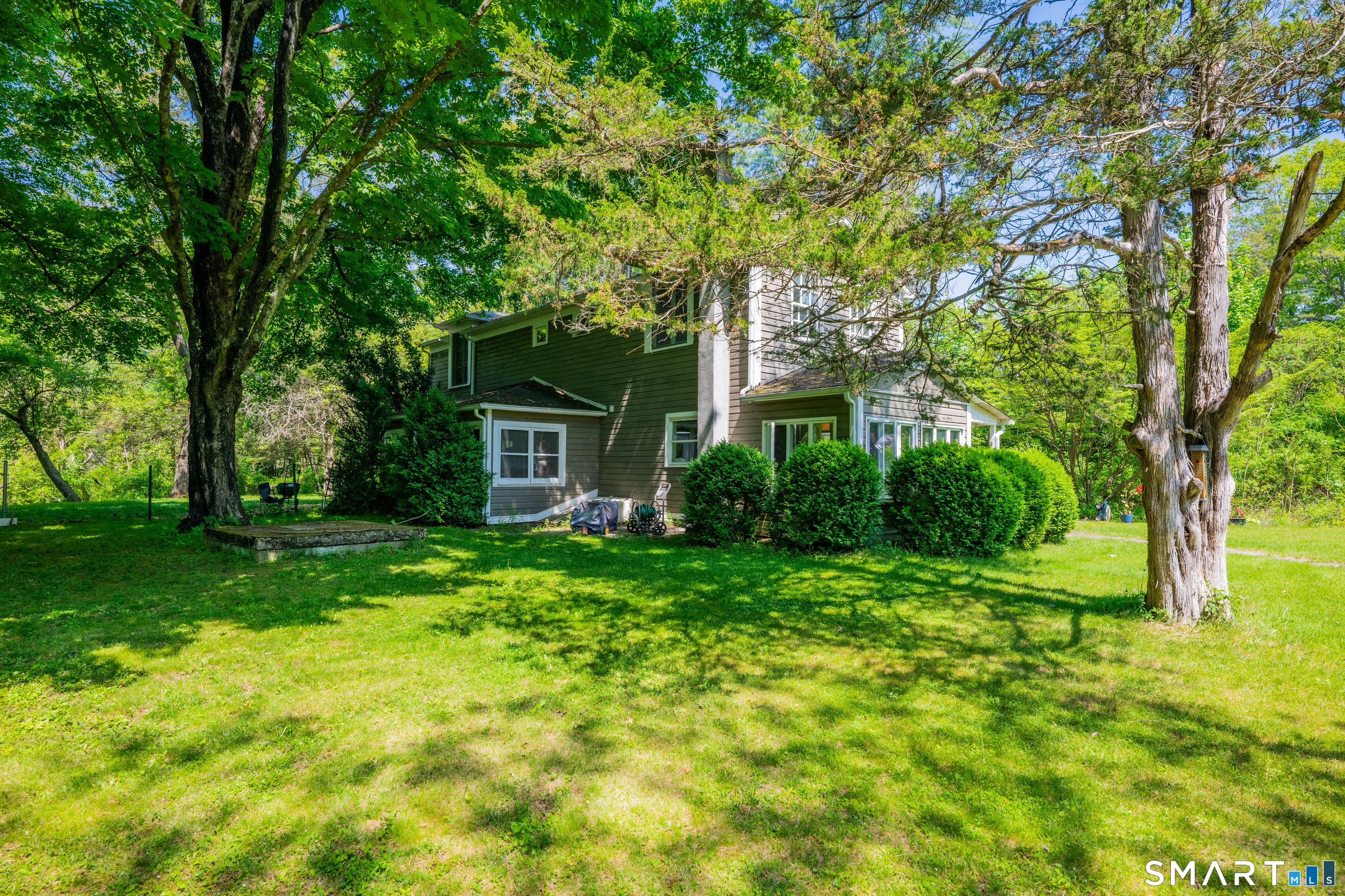 231 B Kent Road Kent, CT 06757 - Photo 22 of 35 a front view of a house with garden