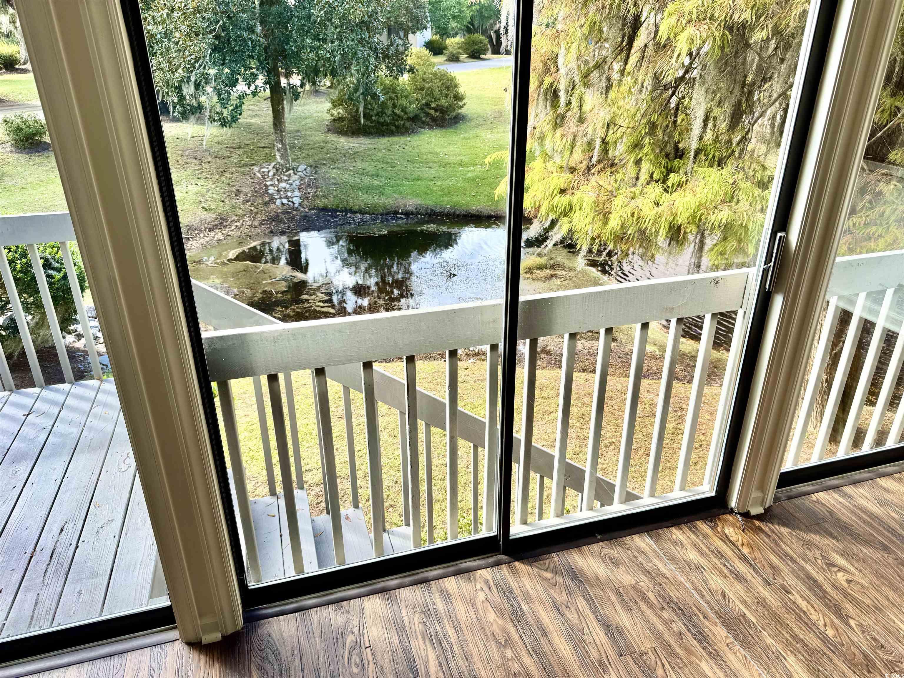 31 Battery White Court, Unit 1005 Georgetown, SC 29440 - Photo 7 of 34 Wooden deck with a yard and a water view