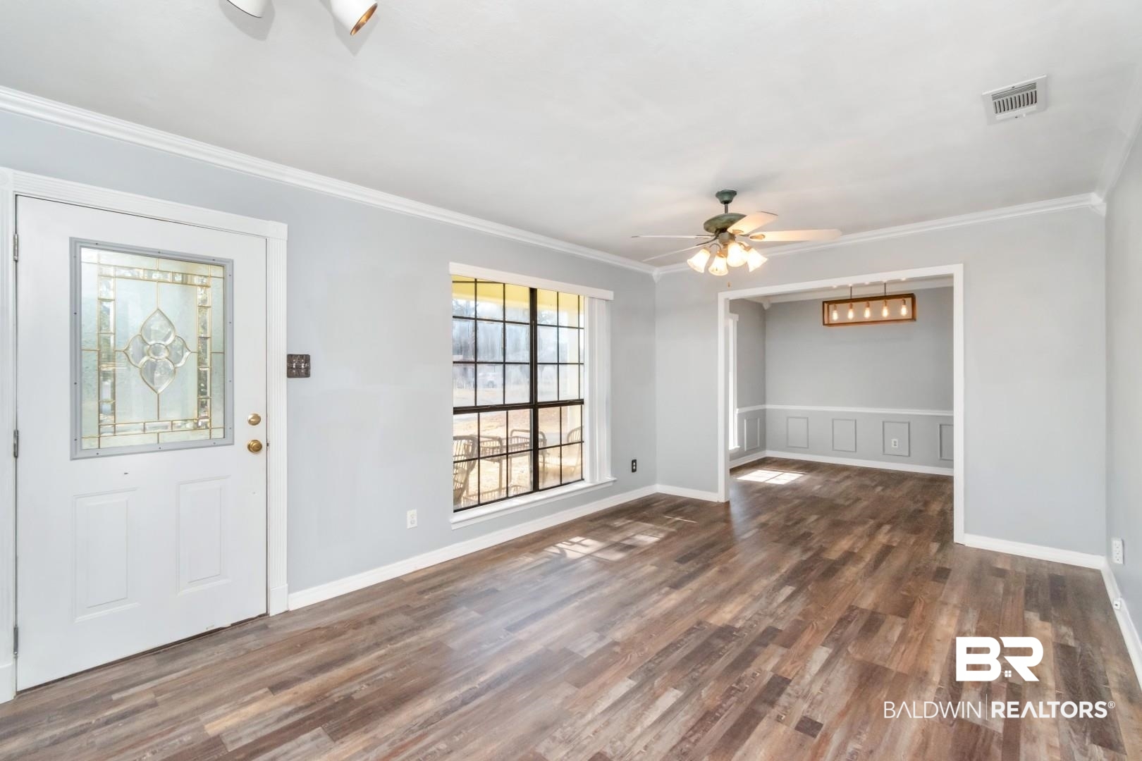 8304 Champlain Circle Mobile, AL 36695 - Photo 8 of 46 Foyer with ornamental molding, ceiling fan, and dark hardwood / wood-style flooring