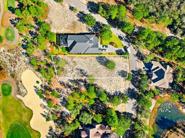 a view of a large yard with lots of green space