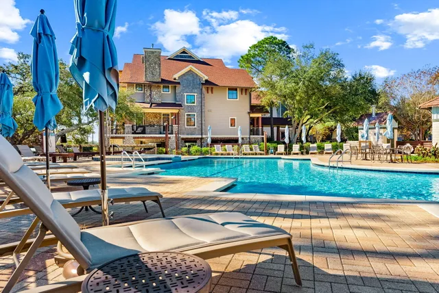 a view of swimming pool with outdoor seating