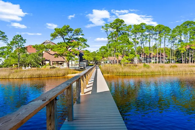 a view of a lake with outdoor seating