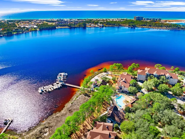 a view of walk in closet with clothes