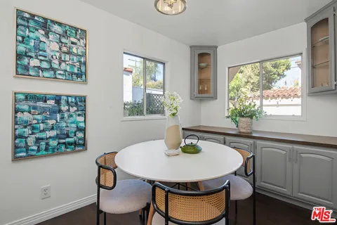 a kitchen with a table and chair