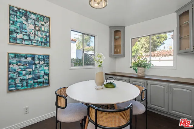 a kitchen with a table and chair