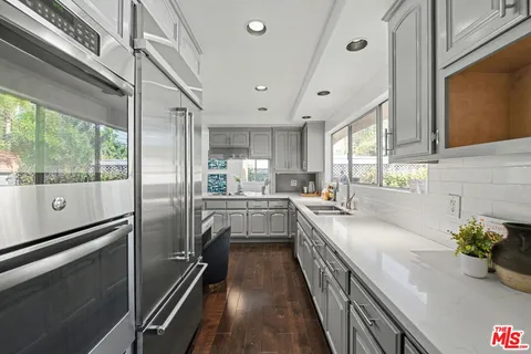 a bedroom with furniture and a fireplace