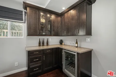 a bedroom with a bed and a night stand