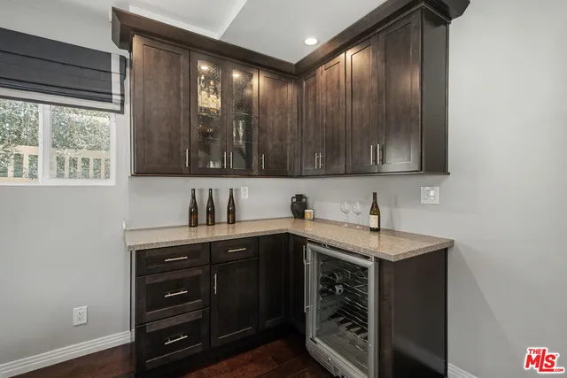 a bedroom with a bed and a night stand