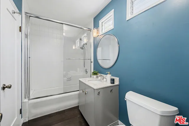 a view of a livingroom with furniture and hardwood floor