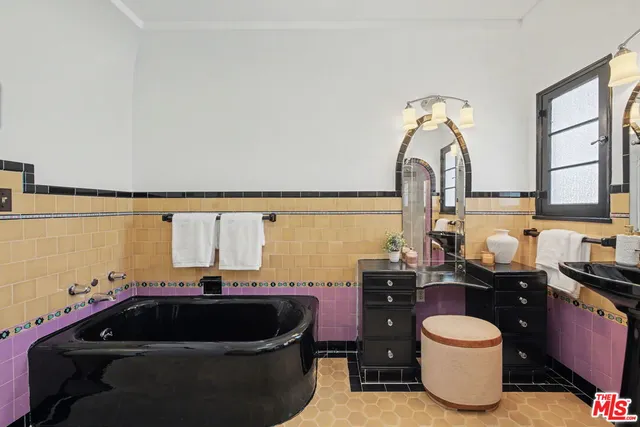 a bathroom with a sink a toilet and bathtub