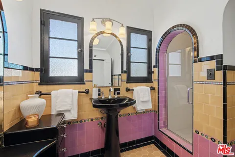 a bathroom with a sink a vanity and a mirror