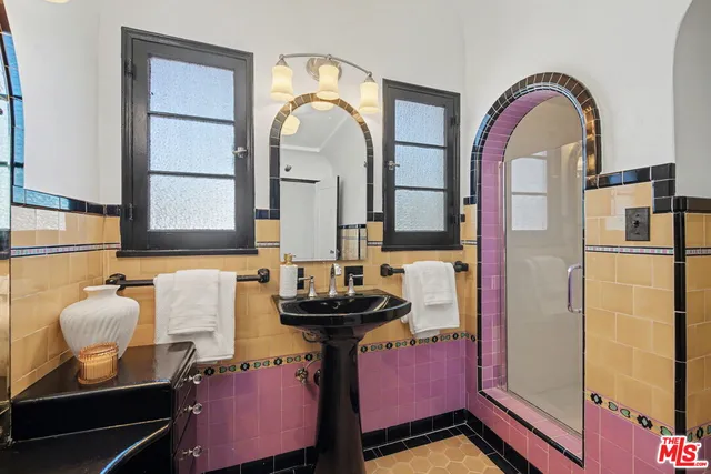 a bathroom with a sink a vanity and a mirror