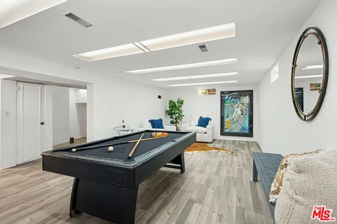 a backyard of a house with yard and outdoor seating