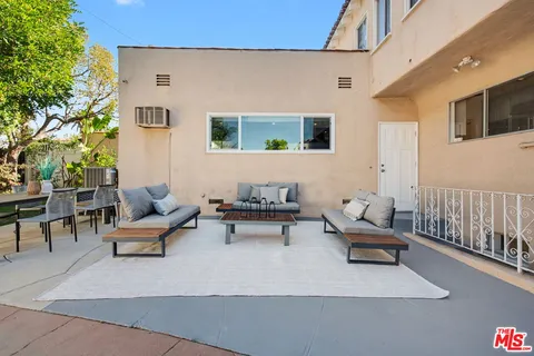 an aerial view of residential houses with city view