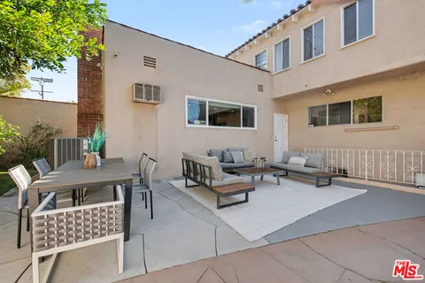 an aerial view of residential houses with city view