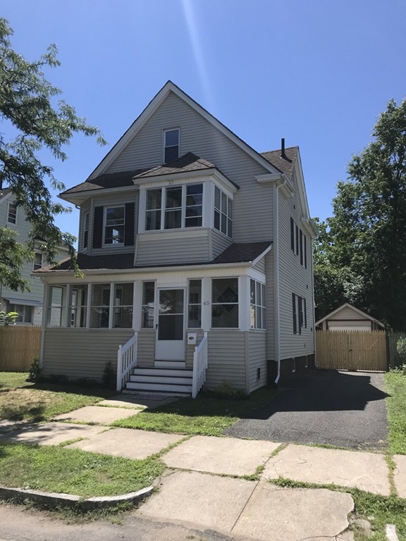 65 Grand Street Springfield, MA 01108 - Photo 11 of 30 a front view of a house with a yard