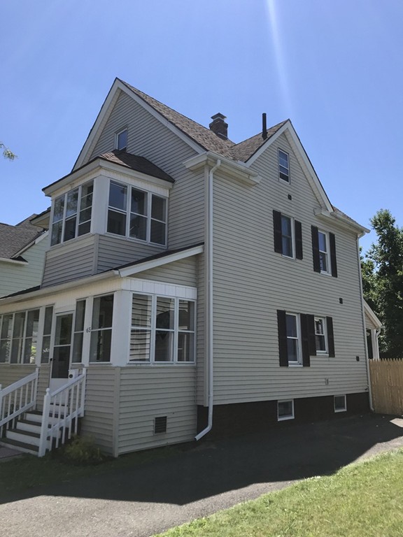 65 Grand Street Springfield, MA 01108 - Photo 13 of 30 a front view of a house with a yard