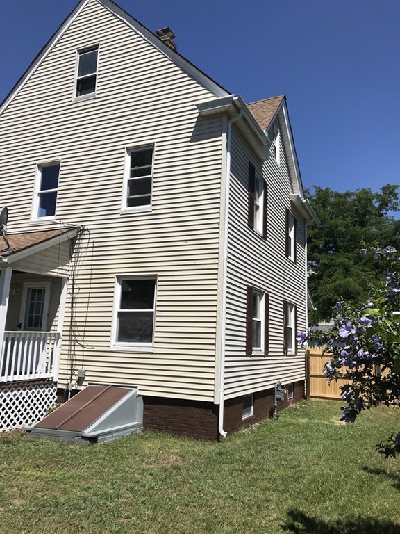 65 Grand Street Springfield, MA 01108 - Photo 16 of 30 a front view of a house with a yard