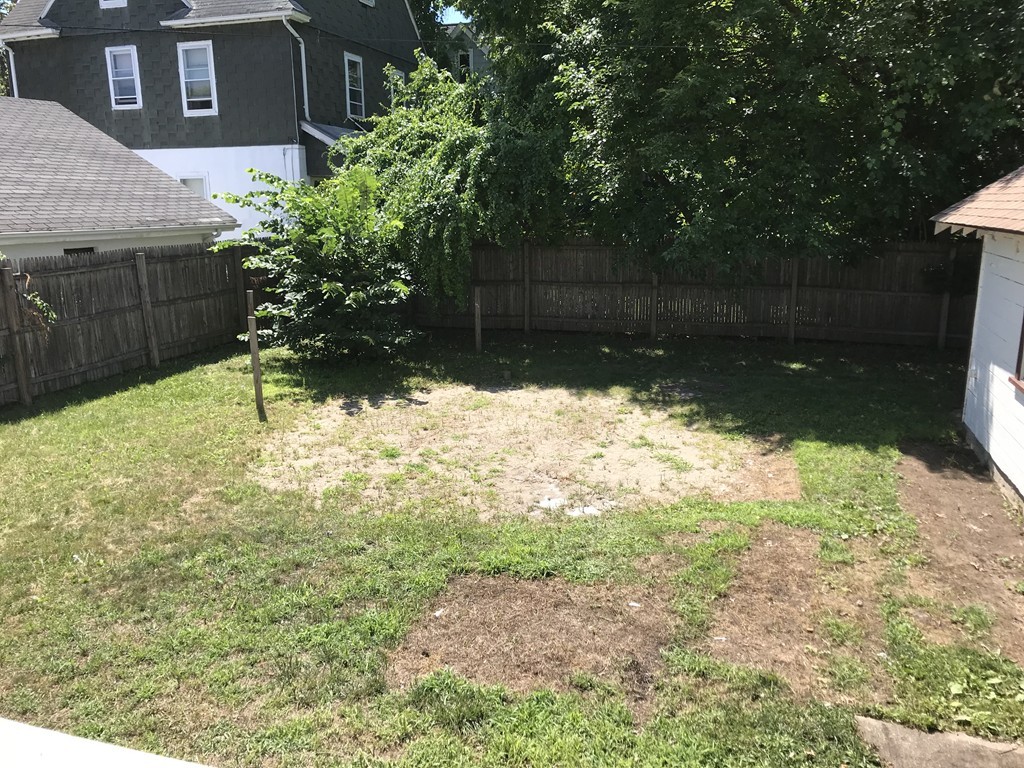 65 Grand Street Springfield, MA 01108 - Photo 18 of 30 a view of a backyard of the house