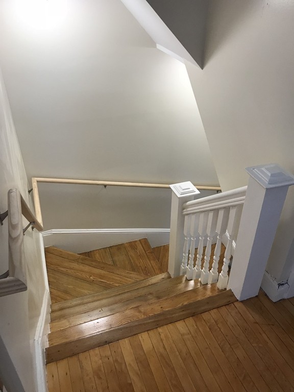 65 Grand Street Springfield, MA 01108 - Photo 20 of 30 a view of walk in closet with clothes and shoes