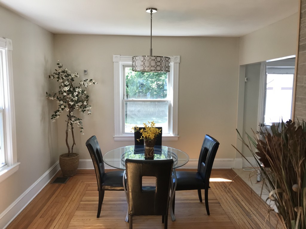 65 Grand Street Springfield, MA 01108 - Photo 24 of 30 a dining room with furniture window and wooden floor