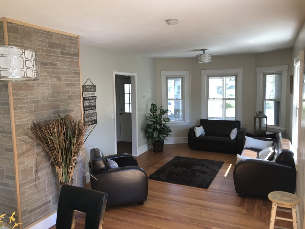 65 Grand Street Springfield, MA 01108 - Photo 25 of 30 a living room with furniture and a potted plant