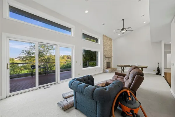 a large kitchen with stainless steel appliances granite countertop a stove refrigerator and cabinets