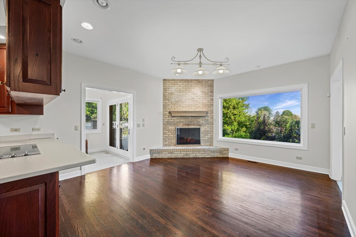 7510 East Tryon Grove Road Richmond, IL 60071 - Photo 19 of 63 a view of an empty room with wooden floor and a window