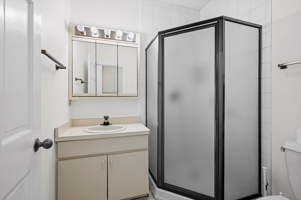 7510 East Tryon Grove Road Richmond, IL 60071 - Photo 23 of 63 a bathroom with a sink and mirror