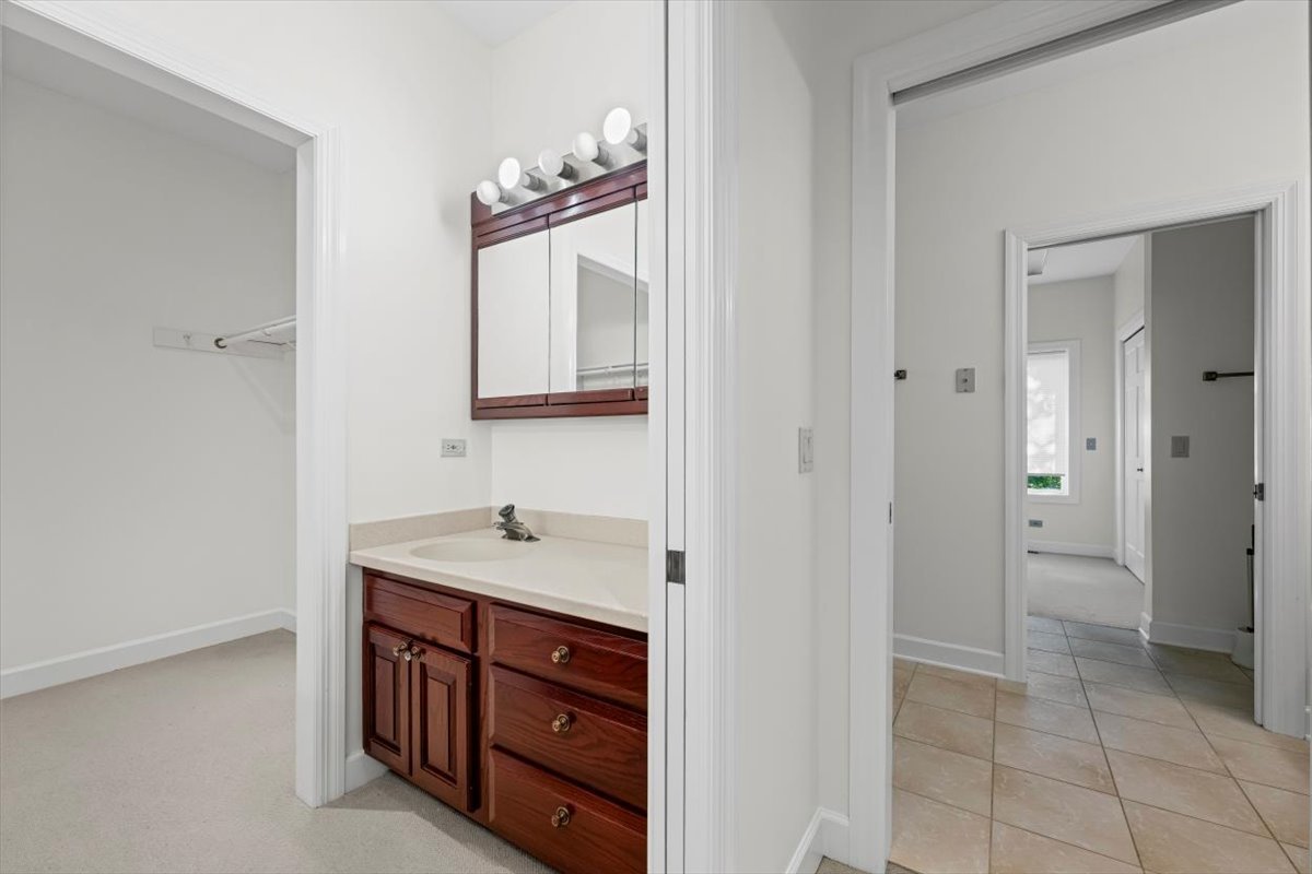 7510 East Tryon Grove Road Richmond, IL 60071 - Photo 29 of 63 a bathroom with a sink and a mirror