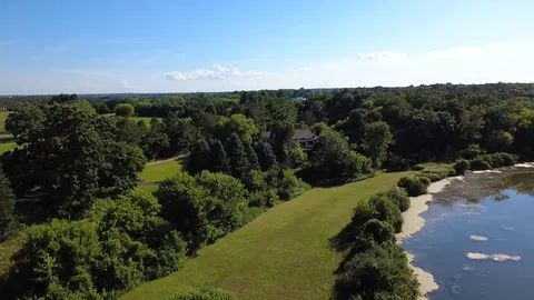a view of a street with a garden