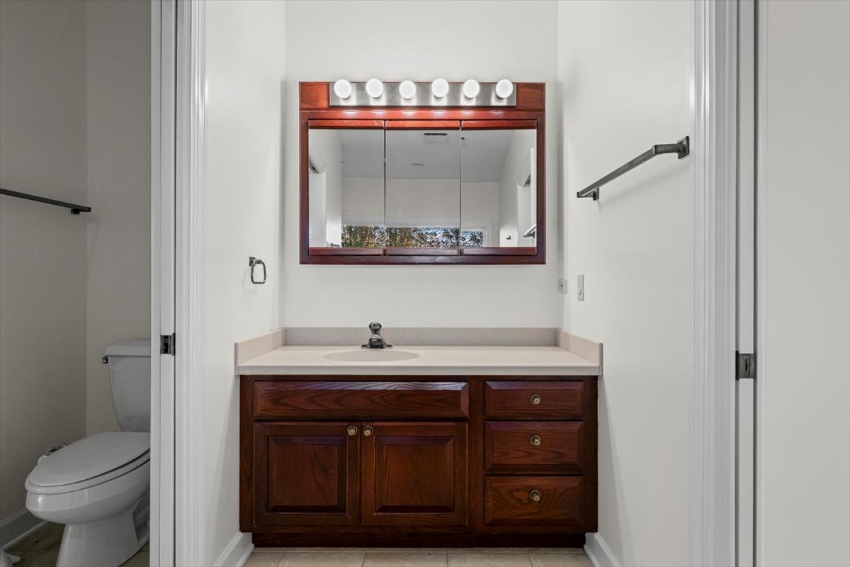 7510 East Tryon Grove Road Richmond, IL 60071 - Photo 31 of 63 a bathroom with a sink and a mirror