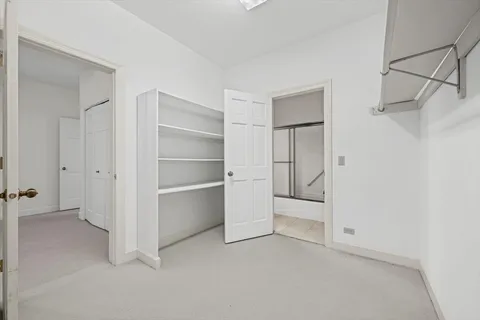 a view of a room with gym equipment and a view of a storage