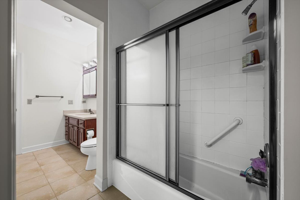 7510 East Tryon Grove Road Richmond, IL 60071 - Photo 37 of 63 a bathroom with a shower and a sink