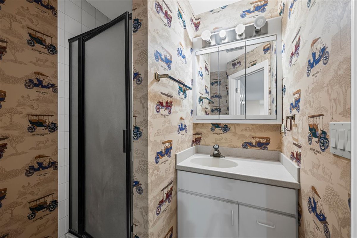 7510 East Tryon Grove Road Richmond, IL 60071 - Photo 40 of 63 a bathroom with a sink and a mirror