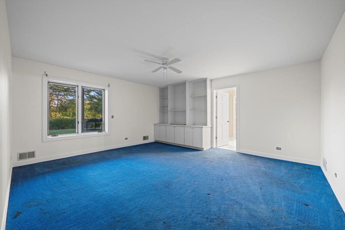 7510 East Tryon Grove Road Richmond, IL 60071 - Photo 44 of 63 a view of an empty room with a window and wooden floor