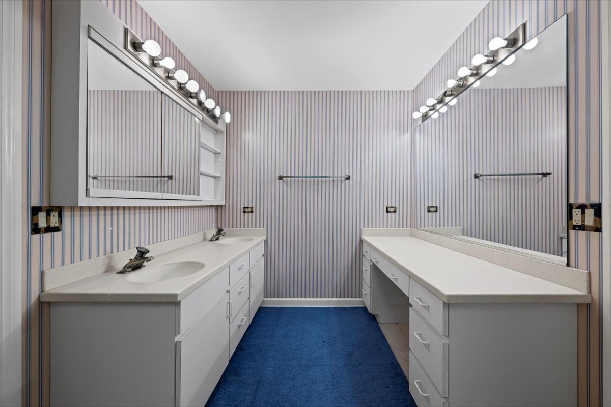 7510 East Tryon Grove Road Richmond, IL 60071 - Photo 46 of 63 a kitchen with white cabinets and sink